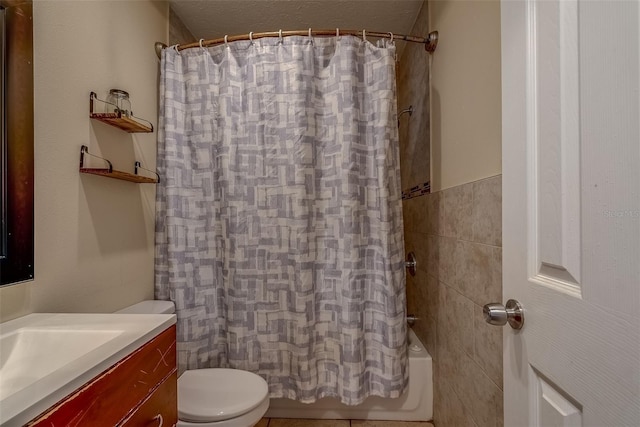 bathroom featuring toilet, tile walls, shower / bath combo, and vanity