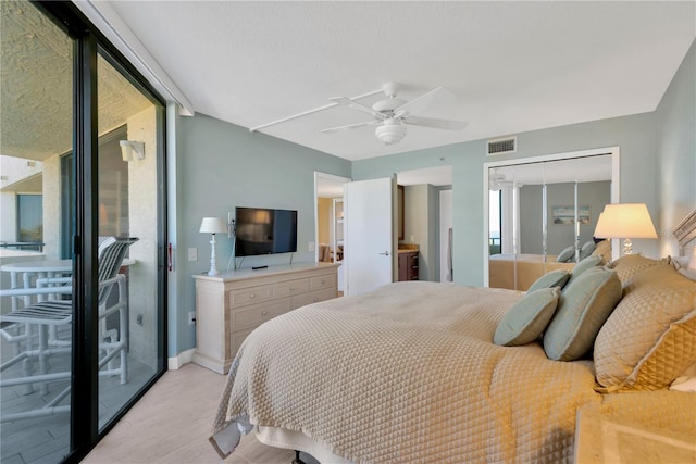 bedroom with visible vents, multiple windows, access to exterior, and light wood-style flooring