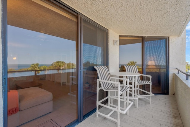 balcony featuring a water view