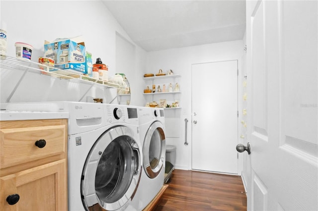 washroom with laundry area, dark wood-type flooring, and washer and clothes dryer