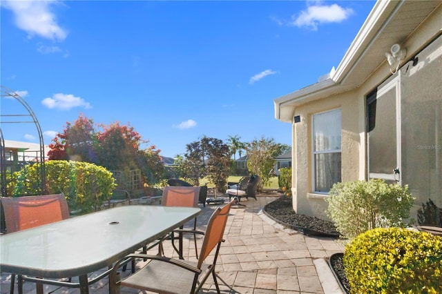 view of patio with outdoor dining area