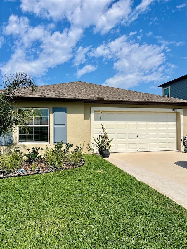 ranch-style home featuring a front yard, roof with shingles, an attached garage, stucco siding, and concrete driveway