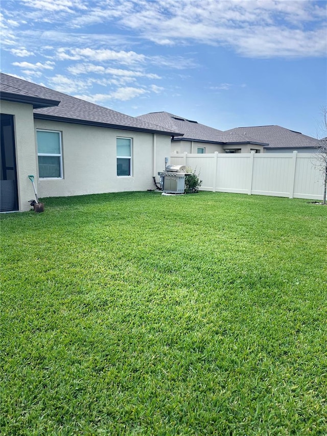 view of yard featuring fence