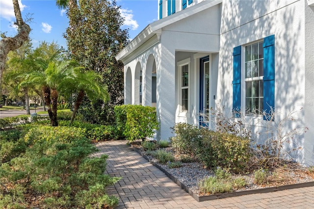 view of side of property with stucco siding