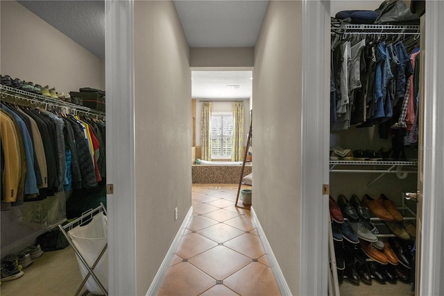 walk in closet featuring light tile patterned floors