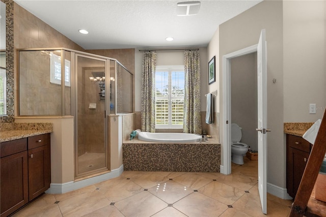 full bathroom featuring vanity, a garden tub, and a shower stall