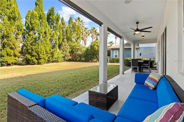 view of patio with an outdoor living space, a ceiling fan, and fence