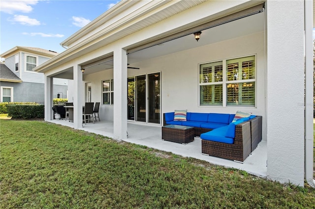 view of patio with outdoor lounge area and a ceiling fan