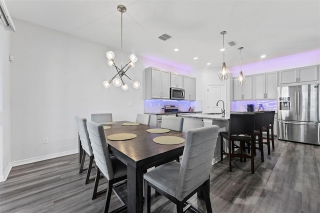 dining space with visible vents, recessed lighting, baseboards, and dark wood-style flooring