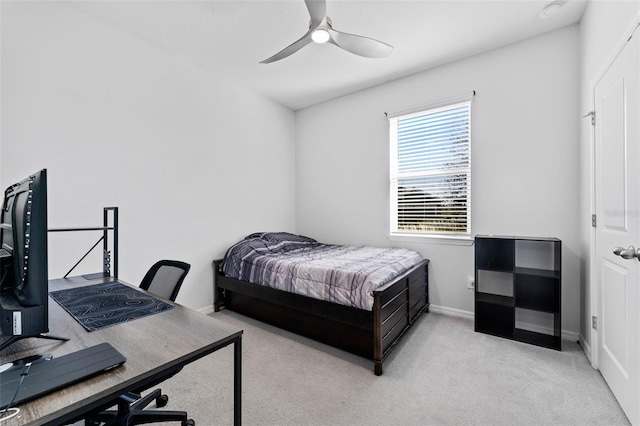 carpeted bedroom featuring a ceiling fan and baseboards