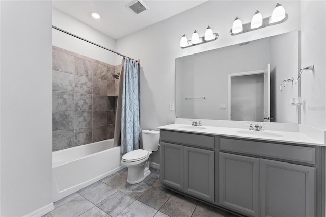 bathroom with toilet, shower / bathtub combination with curtain, visible vents, and a sink