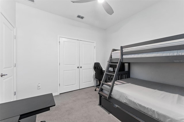 bedroom featuring a closet, visible vents, carpet floors, and ceiling fan