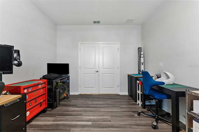 office featuring dark wood-style floors, visible vents, and baseboards