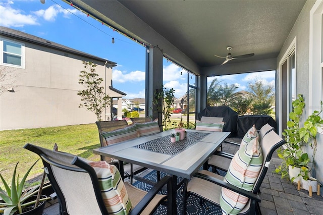 view of patio / terrace featuring outdoor dining space and a ceiling fan