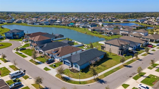 aerial view featuring a residential view and a water view