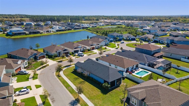 aerial view with a residential view and a water view