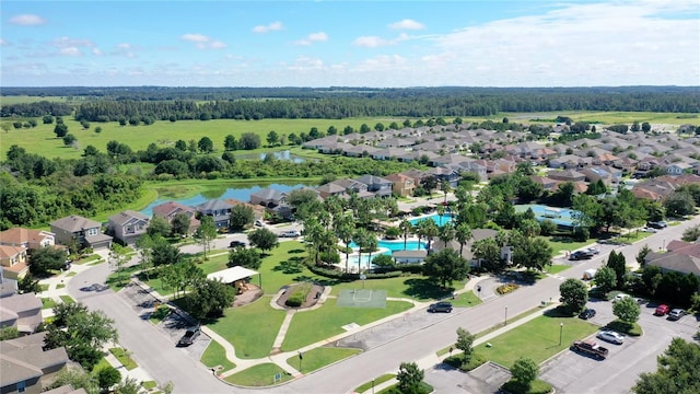 birds eye view of property featuring a residential view and a water view