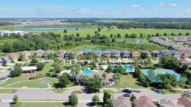 birds eye view of property with a residential view and a water view