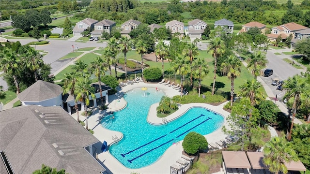 birds eye view of property with a residential view