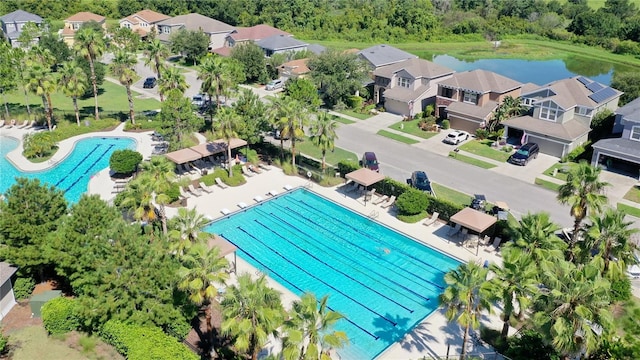 drone / aerial view with a residential view and a water view