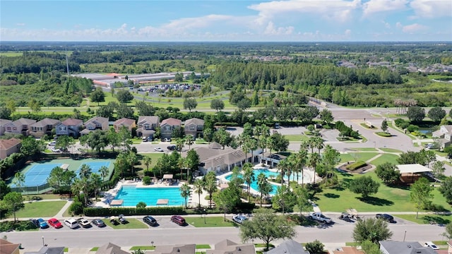 birds eye view of property featuring a forest view