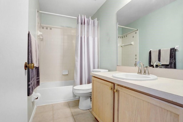 bathroom with tile patterned floors, shower / bath combo with shower curtain, toilet, and vanity