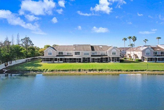 property view of water with a residential view and fence