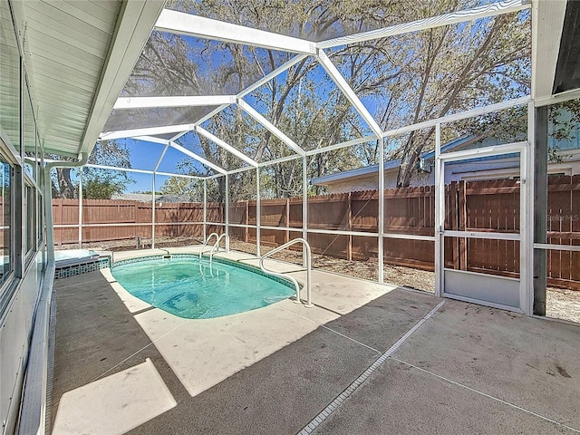 view of pool with a lanai, a fenced in pool, a fenced backyard, and a patio area