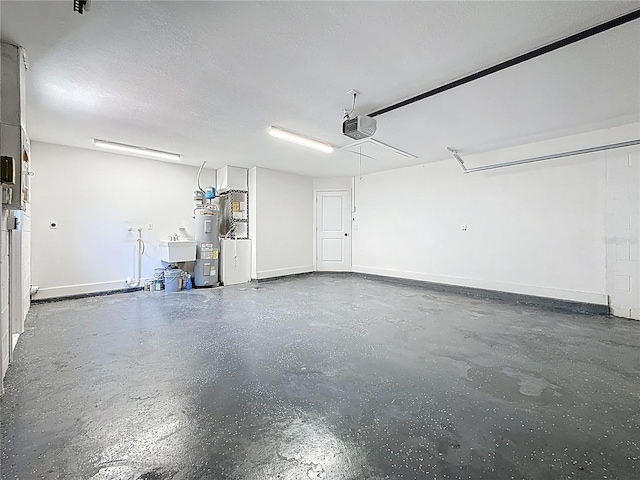 garage with a sink, baseboards, electric water heater, and a garage door opener