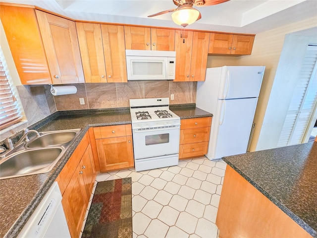 kitchen featuring a sink, white appliances, decorative backsplash, light floors, and ceiling fan