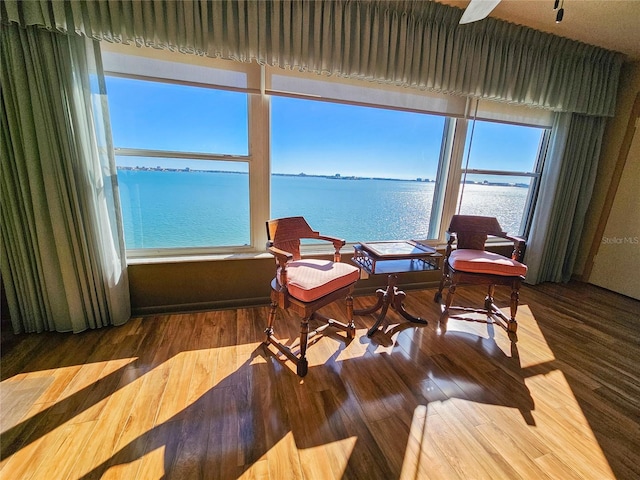 interior space featuring a water view and wood finished floors