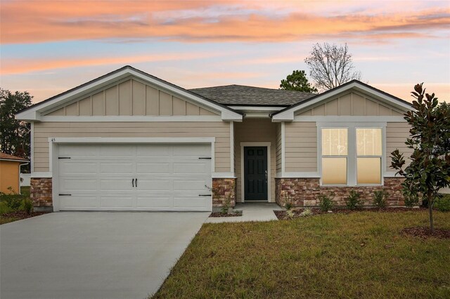 45 Perkins Ln, Palm Coast, FL 32164 - craftsman house with stone siding, driveway, a front yard, and an attached garage
