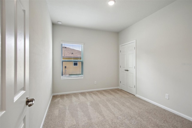45 Perkins Ln, Palm Coast, FL 32164 - carpeted spare room featuring baseboards