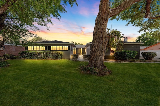 view of front of home with a front lawn