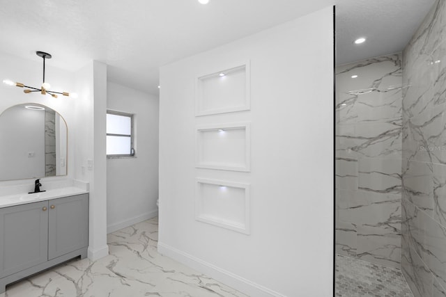 bathroom with vanity, baseboards, a marble finish shower, recessed lighting, and marble finish floor