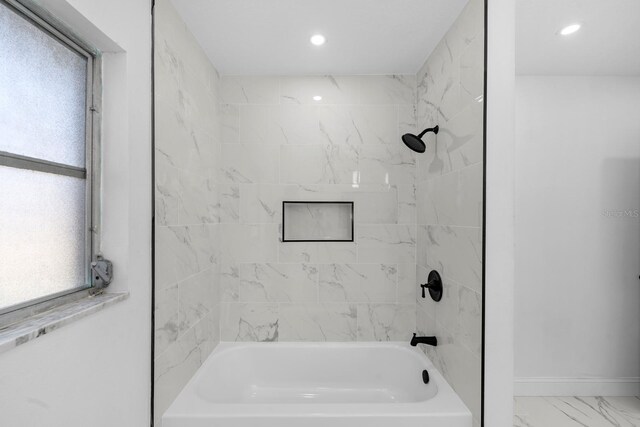 bathroom featuring recessed lighting, marble finish floor, shower / bath combination, and baseboards