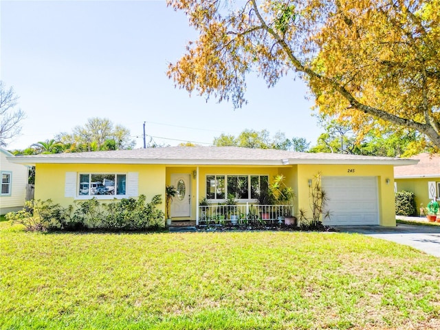 single story home featuring a garage, stucco siding, driveway, and a front lawn