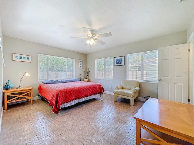 bedroom featuring baseboards and a ceiling fan