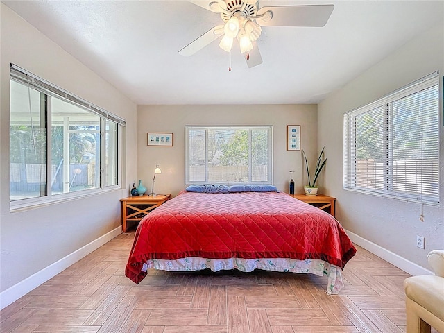 bedroom featuring ceiling fan and baseboards