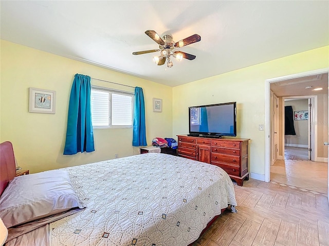 bedroom with baseboards and a ceiling fan