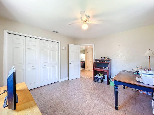 home office featuring visible vents, baseboards, and ceiling fan