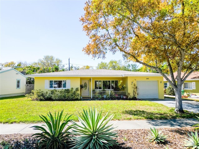 ranch-style house with stucco siding, an attached garage, concrete driveway, and a front lawn