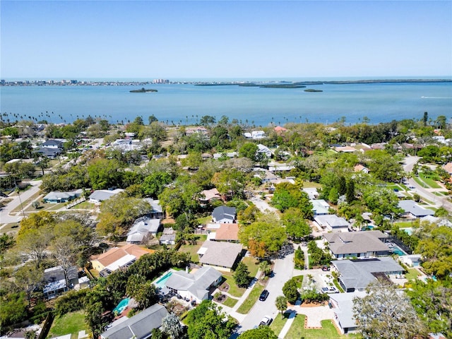 drone / aerial view with a residential view and a water view