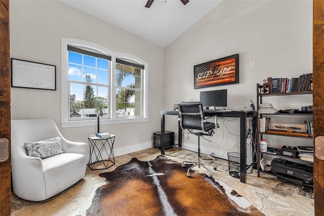 office area featuring baseboards, lofted ceiling, and a ceiling fan