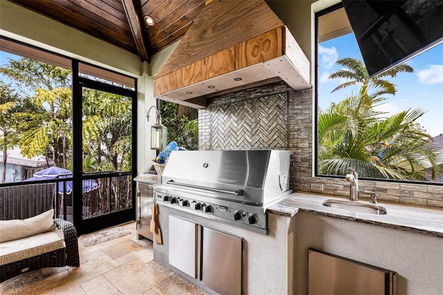 view of patio / terrace with a sink, a gazebo, and area for grilling