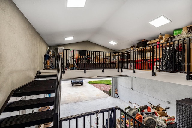 staircase with vaulted ceiling