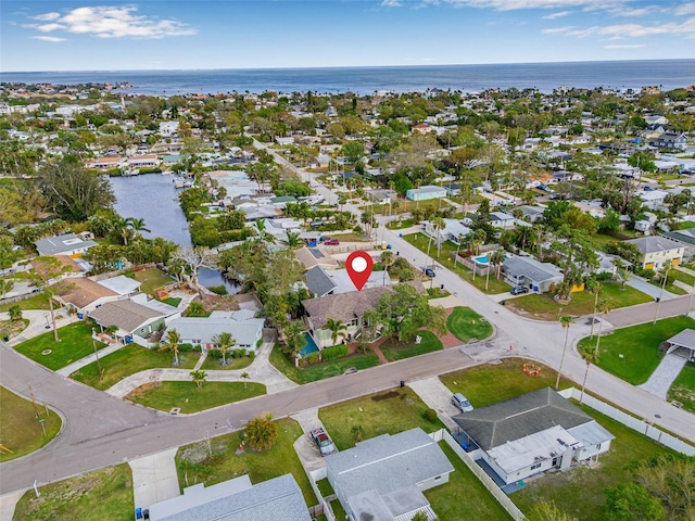 birds eye view of property with a residential view and a water view