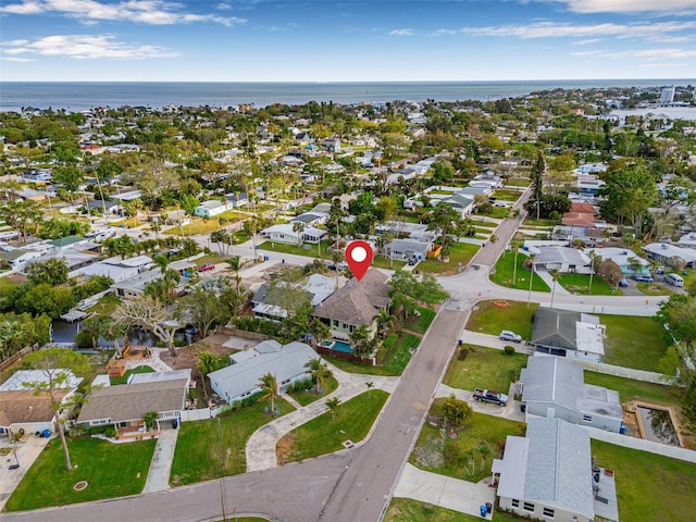 drone / aerial view featuring a water view and a residential view