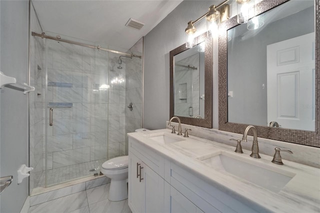 bathroom with a sink, toilet, and a stall shower