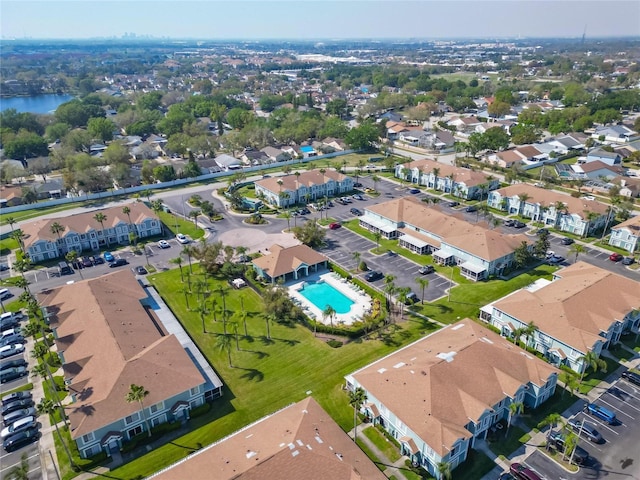 bird's eye view with a residential view and a water view